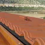 View on a roof with Isoline and clay tiles