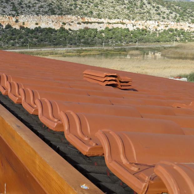 View on a roof with Isoline and clay tiles