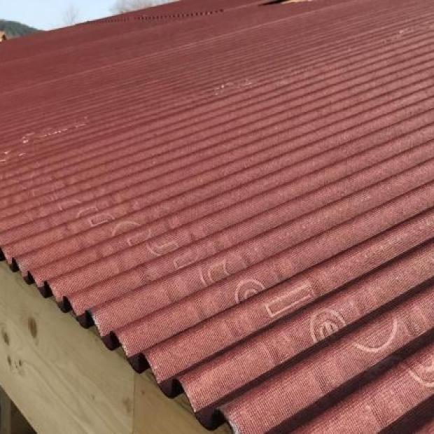 View on a roof with installed Isoline sheets and clay tiles to be installed